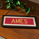 Framed Ames Red and Gold Bus Scroll - Tejas Country Club