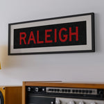 Framed Raleigh Red and Black Bus Scroll - Tejas Country Club