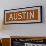Framed Austin Orange Bus Scroll - Tejas Country Club