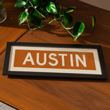 Framed Austin Orange Bus Scroll - Tejas Country Club